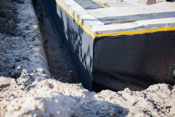 Professional Waterproofing technician working in Greenville, NC